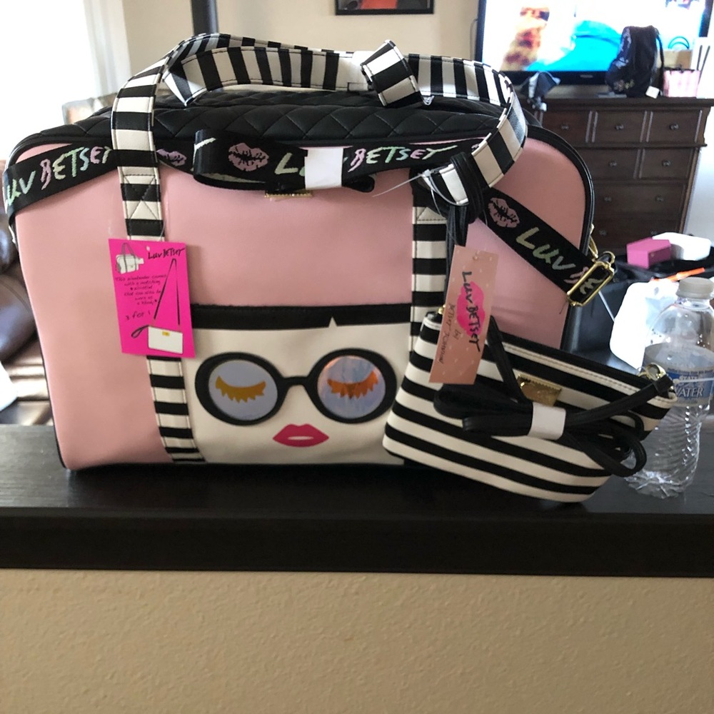 Travel bag or diaper bag with a little satchel